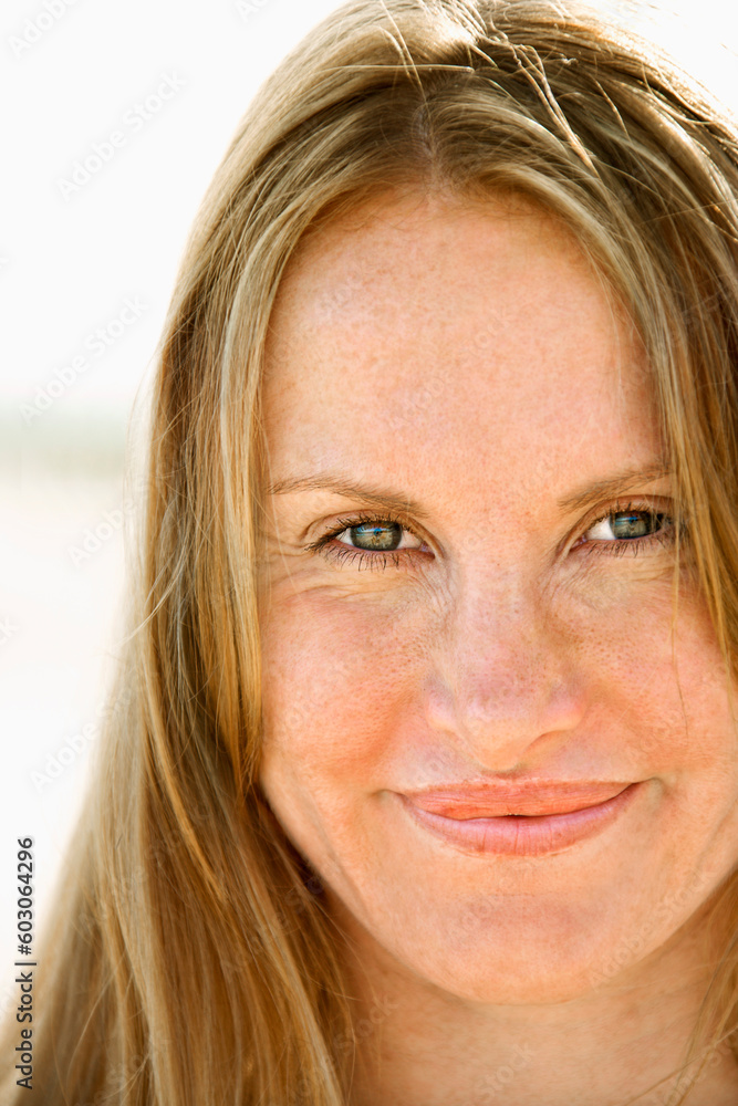 Close up portrait of attractive redheaded woman looking at viewer. Close up portrait of attractive redheaded woman looking at viewer.