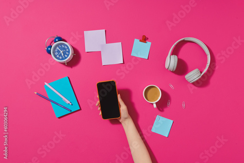 Creative flat lay photo of workspace desk with smartphone photo