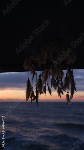 Dreamcatcher sunrise on sea.
 photo