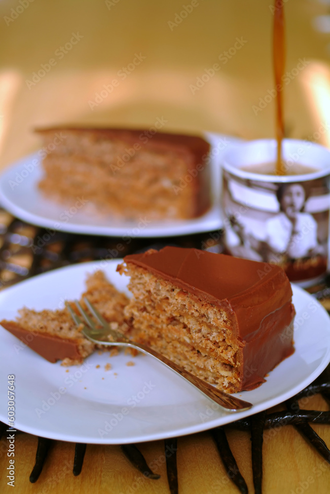 chocolate cake and coffee being poured into mug chocolate cake and coffee being poured into mug