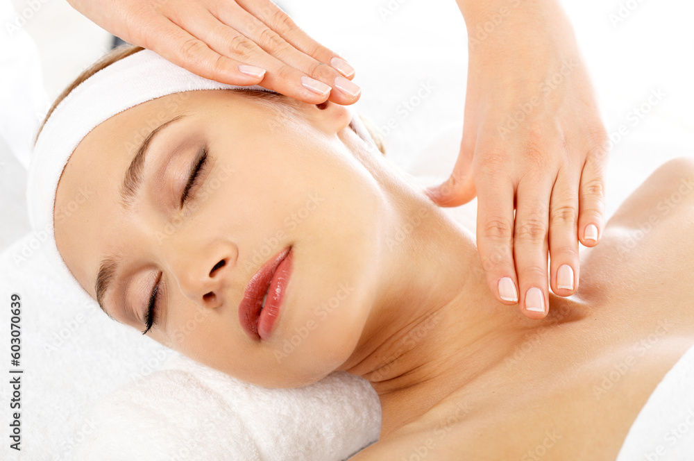 Young beautiful and relaxed lady taking spa treatment