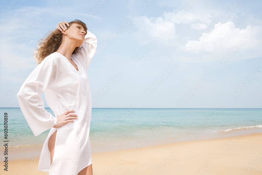 Portrait of nice young woman having good time on the beach Portrait of nice young woman having good time on the beach