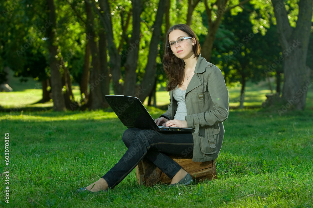 student with notebook in the park student with notebook in the park