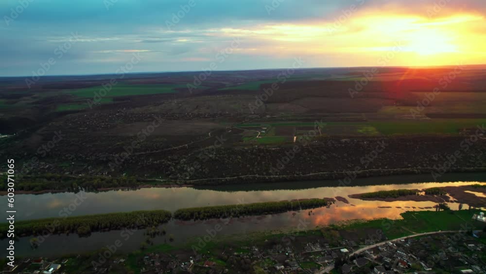 Aerial drone view of Dniester river in Moldova at sunset. Village Saharna and greenery around Aerial drone view of Dniester river in Moldova at sunset. Village Saharna and greenery around