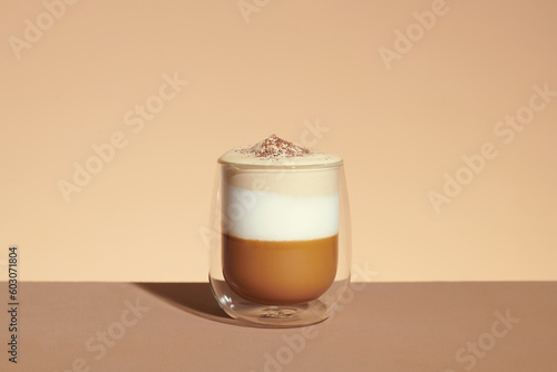 milk latte with coffee foam in glass mug with ingredients photo