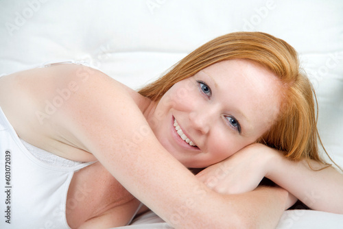 Female model with red hair in a casual pose