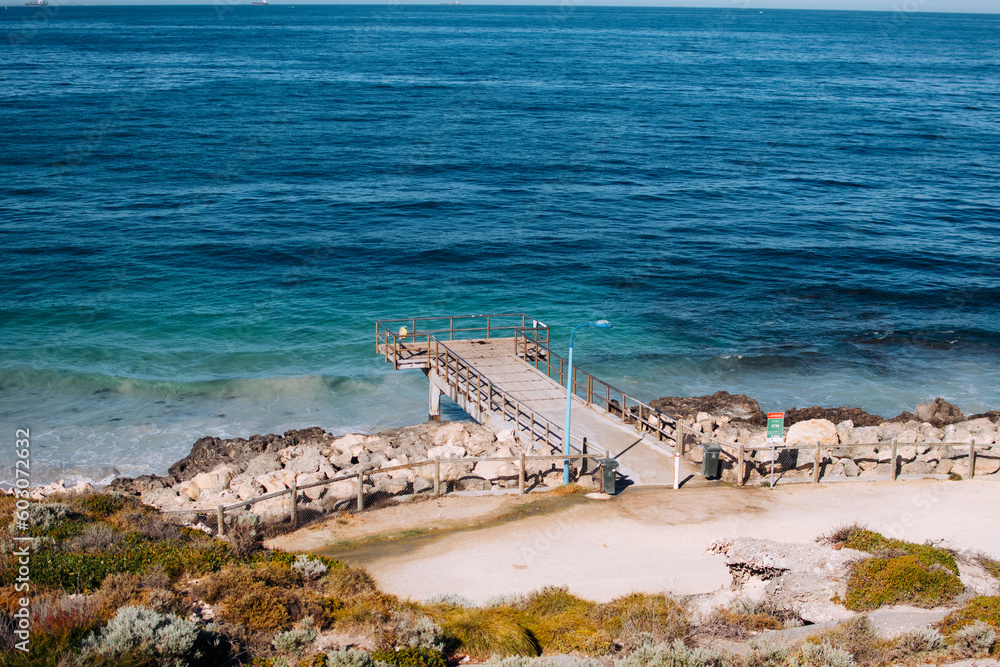 Small jetty over deep blue ocean Small jetty over deep blue ocean