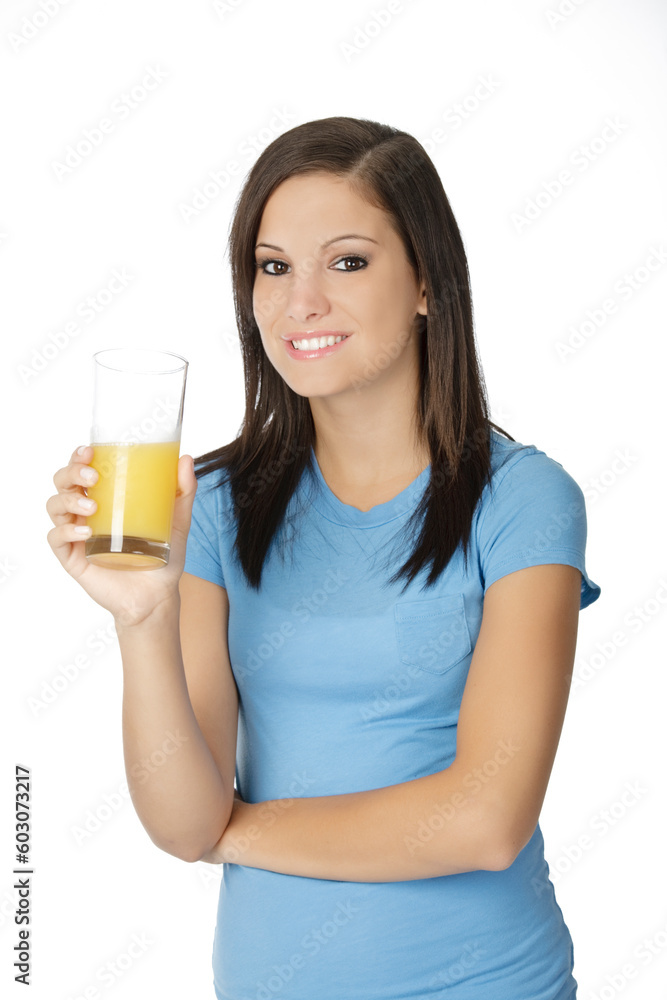 Beautiful Caucasian woman holding a glass of orange juice Beautiful Caucasian woman holding a glass of orange juice