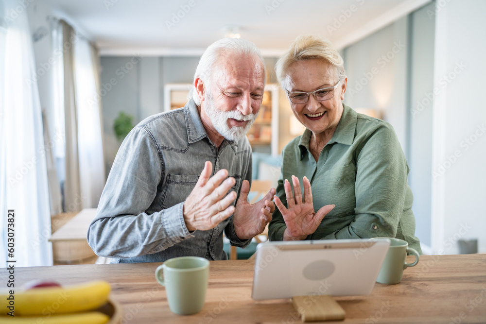 senior couple man woman husband and wife use digital tablet video call senior couple man woman husband and wife use digital tablet video call