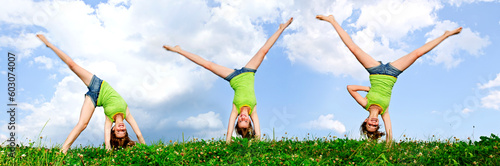 Photos Composite image of young teenage girl doing cartwheel in a summer meadow
