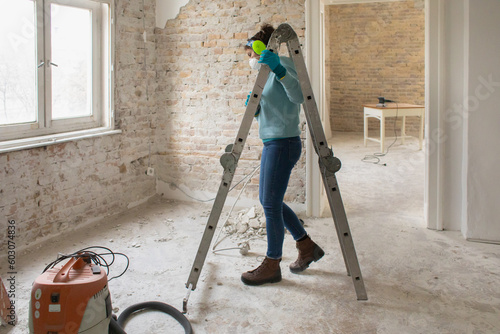 A woman is renovating her home photo