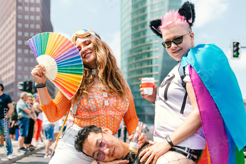Colourfully dressed friends at a pride parade on Potsdamer Platz  photo