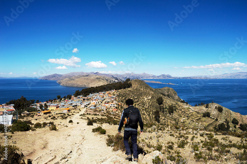 Man walking on Isla del Sol on Lake Titicaca