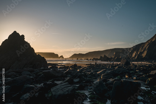 A rocky Pembrokeshire beach at dusk. photo