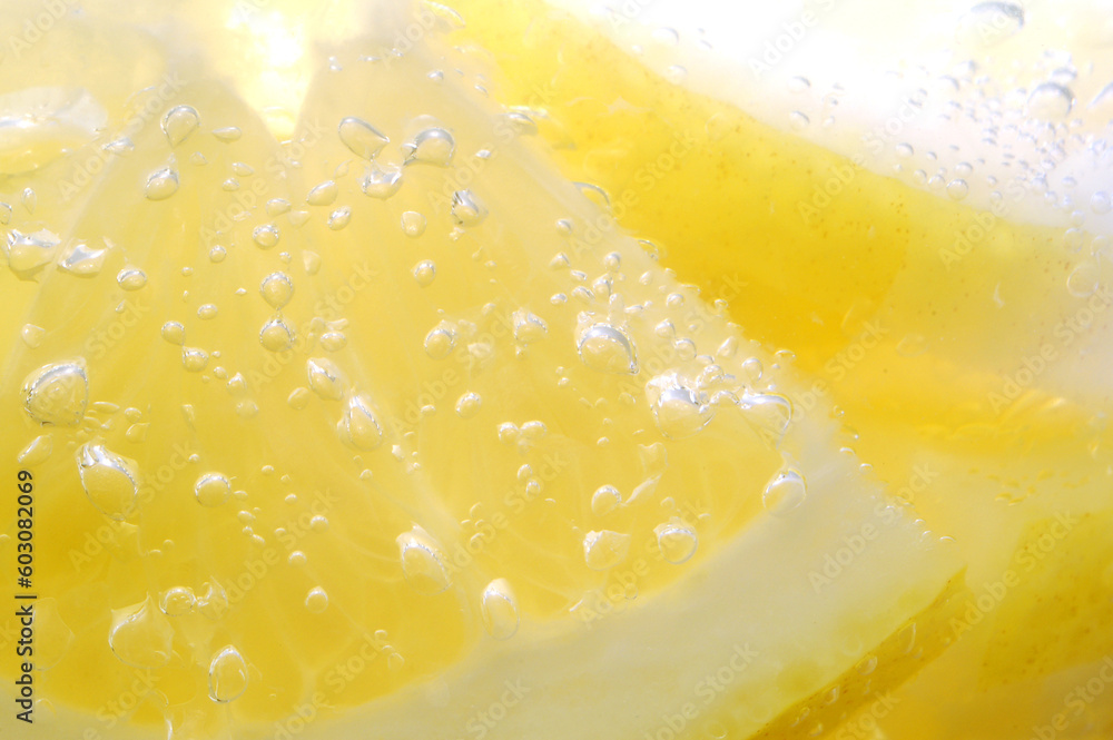 Lemon slices covered in air bubbles from the sparkling water