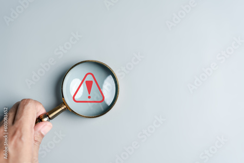 Photography System warning caution sign inside magnifier for notification error and maintenance