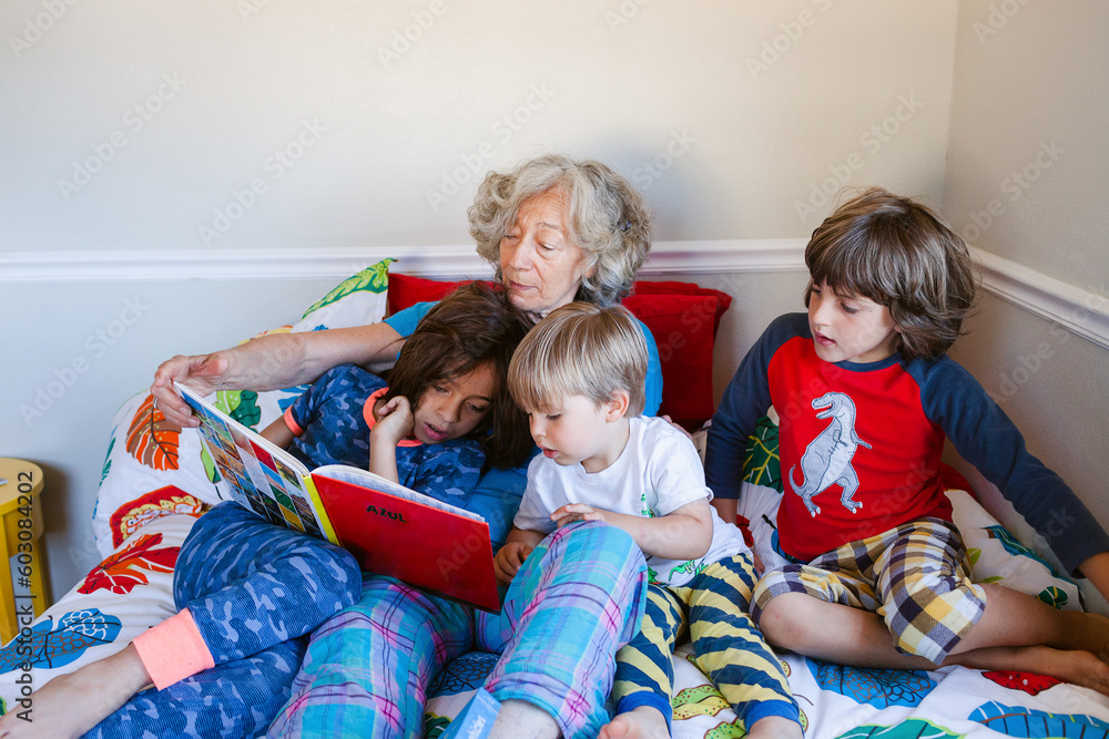 Grandmother storytelling grandsons in bed Grandmother storytelling grandsons in bed