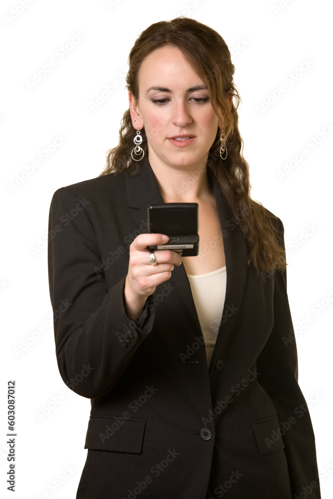 Attractive young brunette business woman reading a pager with text messaging over white Attractive young brunette business woman reading a pager with text messaging over white