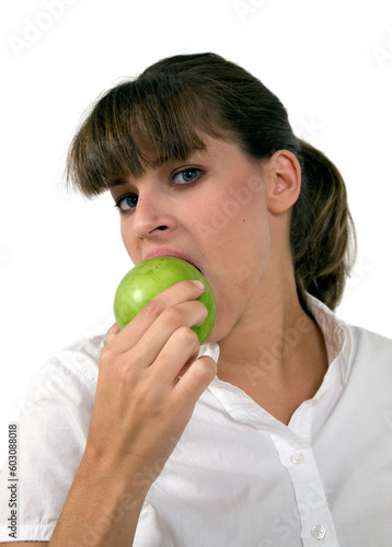 close up of woman eating apple on isolated background