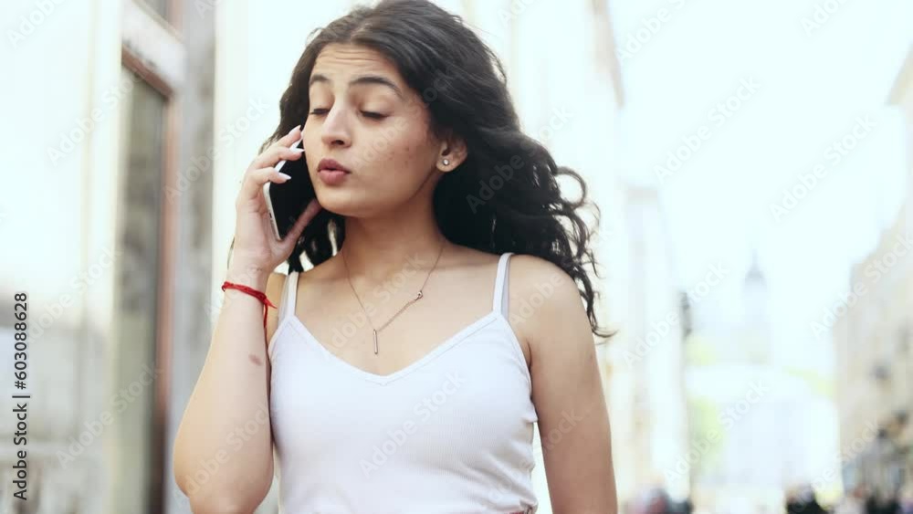 Irritated arguing young woman yelling at mobile phone while sitting on couch at home Angry nervous female talk on smartphone expressing negative emotion Bad conflict working or personal conversation Irritated arguing young woman yelling at mobile phone while sitting on couch at home Angry nervous female talk on smartphone expressing negative emotion Bad conflict working or personal conversation