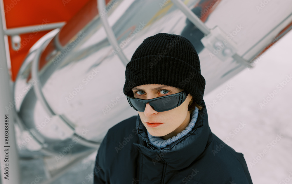 androgyne person with sunglasses androgyne person with sunglasses