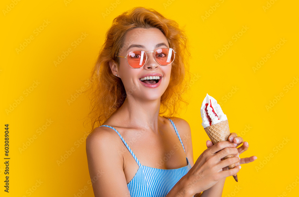 smiling woman with cone icecream isolated on yellow. woman with cone icecream in studio. smiling woman with cone icecream isolated on yellow. woman with cone icecream in studio.