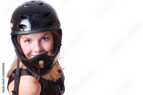 Close-up portrait of blonde girl in black helmet isolated on white © Designpics