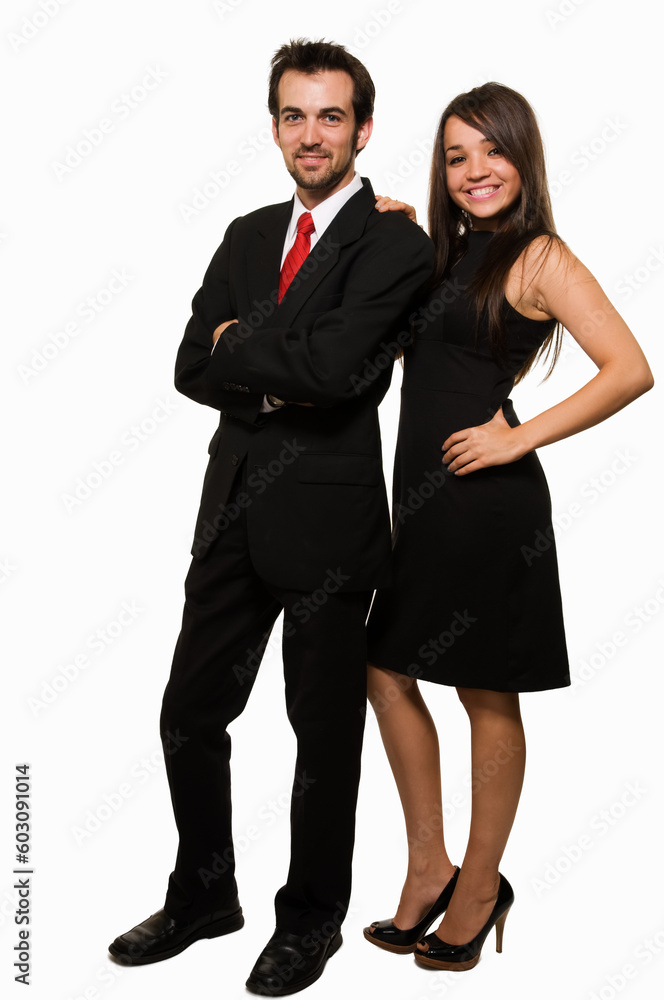 Full body of an attractive brunette woman wearing black formal dress and man in suit and red tie standing beside each other over white Full body of an attractive brunette woman wearing black formal dress and man in suit and red tie standing beside each other over white
