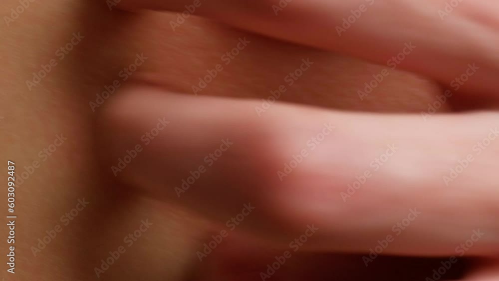 A woman's hand scratches a reddened inflamed place on the skin close-up. Itching, scabies, eczema A woman's hand scratches a reddened inflamed place on the skin close-up. Itching, scabies, eczema