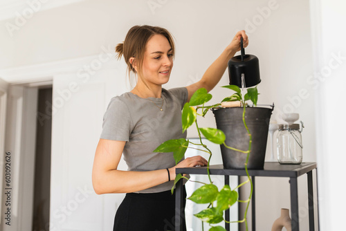 Woman watering plant