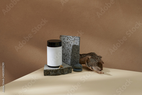 White jar with natural medicinal supplement on a podium photo