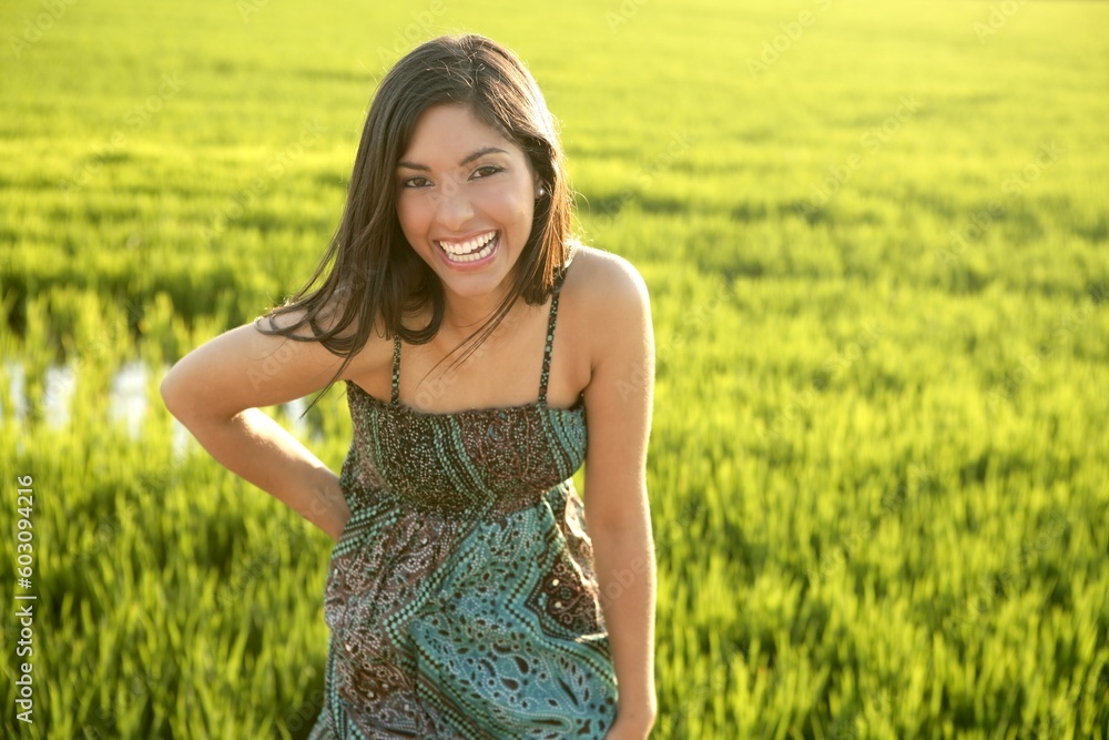 Beautiful brunette indian young woman in the green rice fields meadow Beautiful brunette indian young woman in the green rice fields meadow