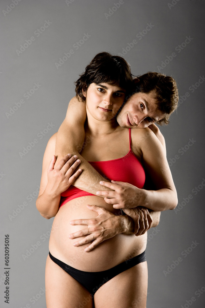 Naklejka premium Beautiful happy couple in love expecting a baby