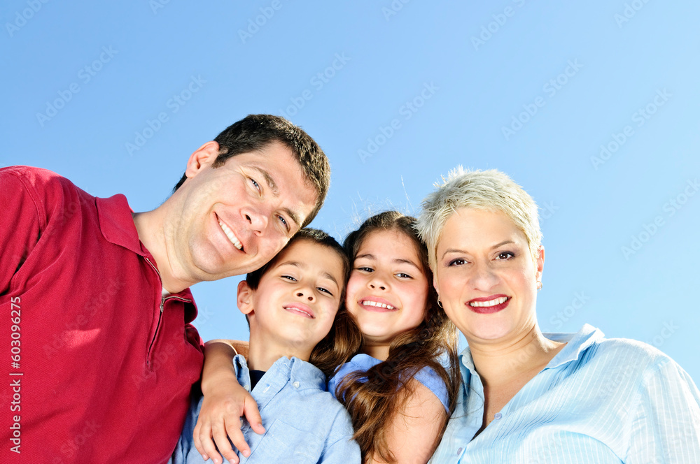 Portrait of happy family of four smiling