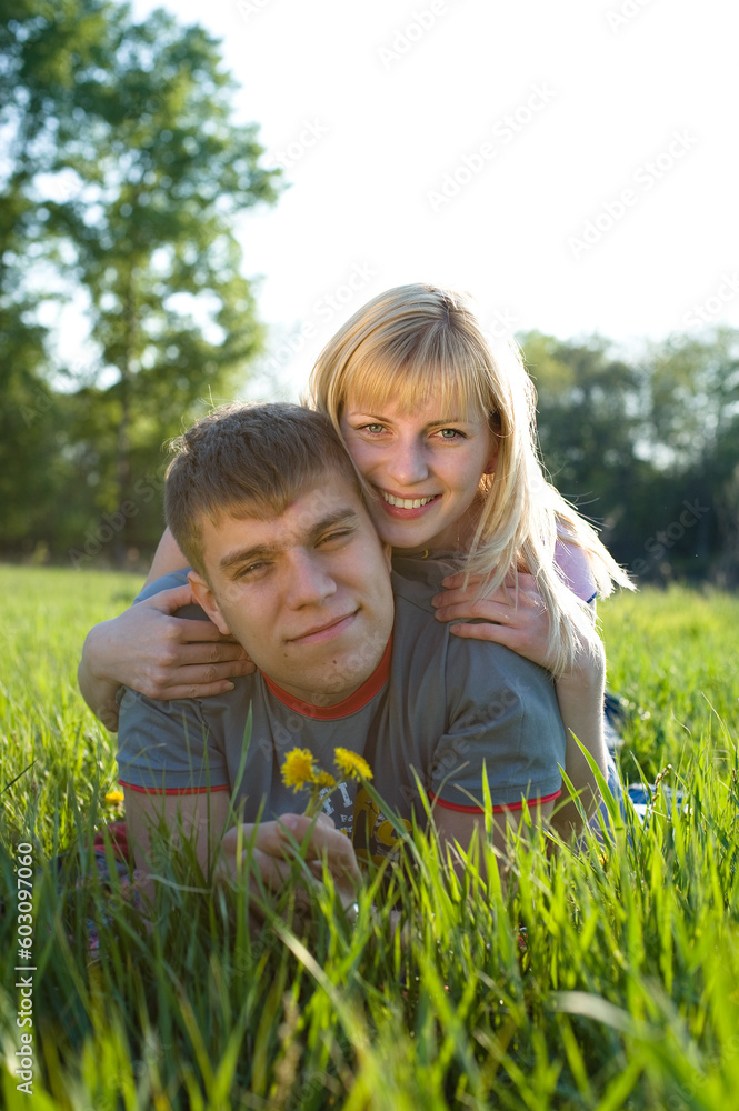 Fototapeta premium Happiness couple in love on green grass