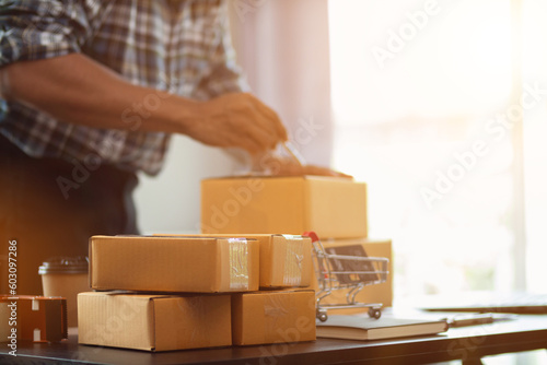 Small sme entrepreneurs run sme business at home and prepare enough products for taking orders through online sales applications with e-commerce systems and delivering with courier companies.