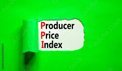 PPI Producer price index symbol. Concept words PPI Producer price index on beautiful white paper. Beautiful green table green background. Business and PPI Producer price index concept. Copy space.