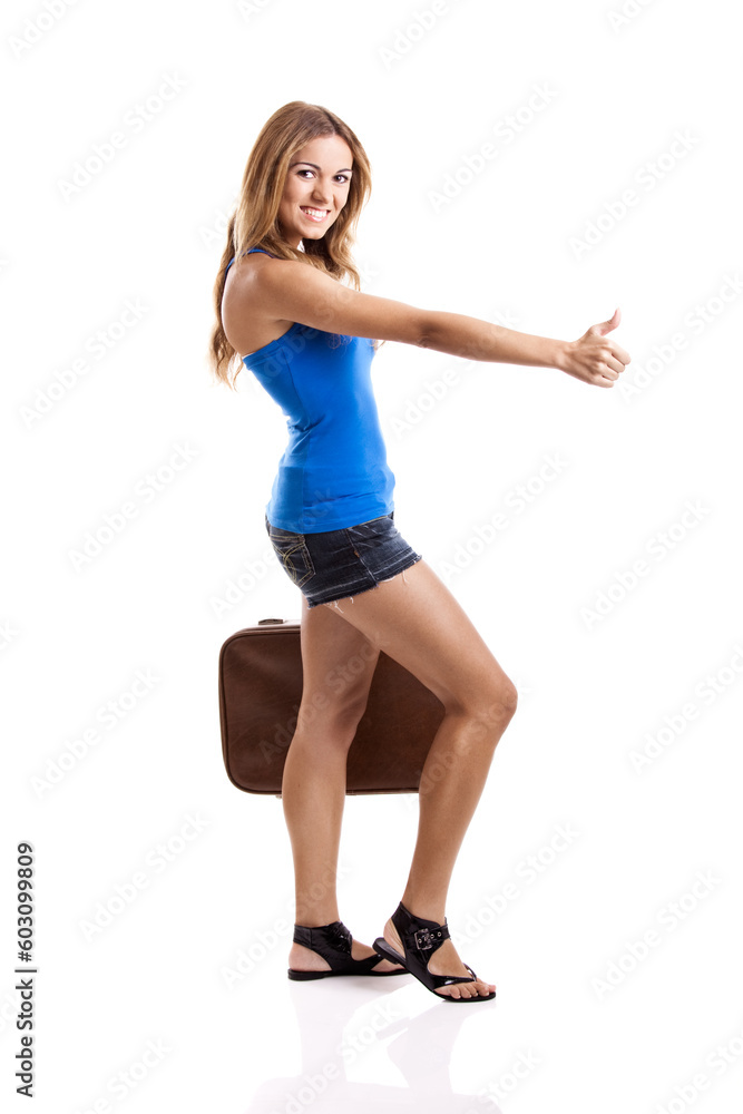 Beautiful young woman hitch hiking with old leather suitcase, isolated on white Beautiful young woman hitch hiking with old leather suitcase, isolated on white