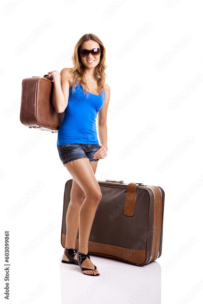 Beautiful and happy young woman with old leather suitcases, isolated on white Beautiful and happy young woman with old leather suitcases, isolated on white