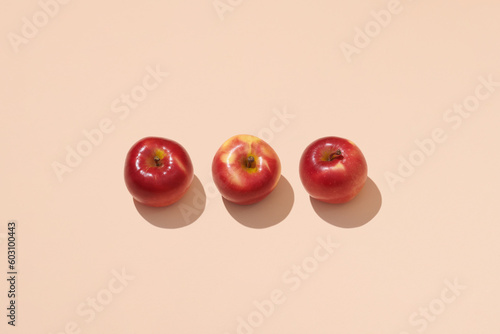 Creative pattern made of apple on beige background. Flat lay. photo