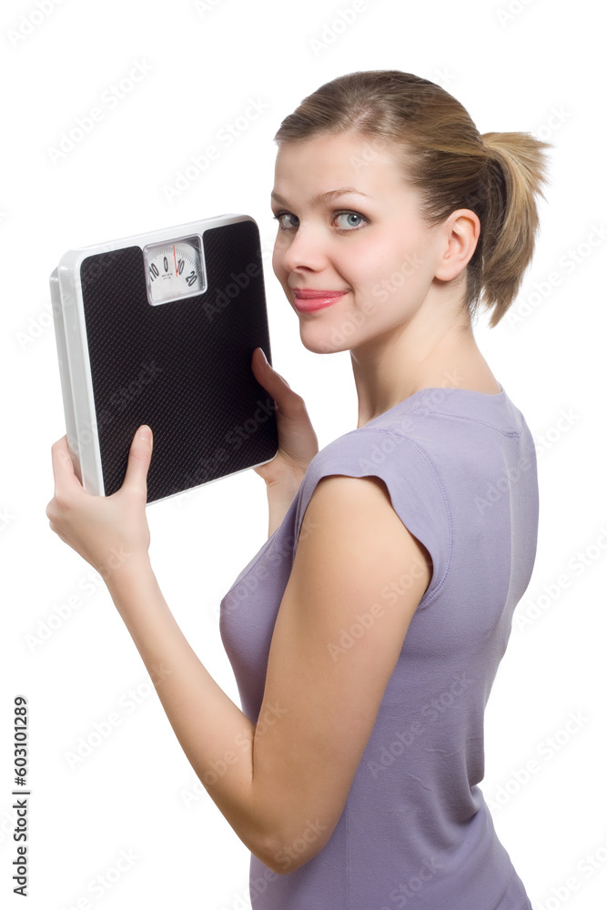 smiling young woman holding a weight scale over white background smiling young woman holding a weight scale over white background