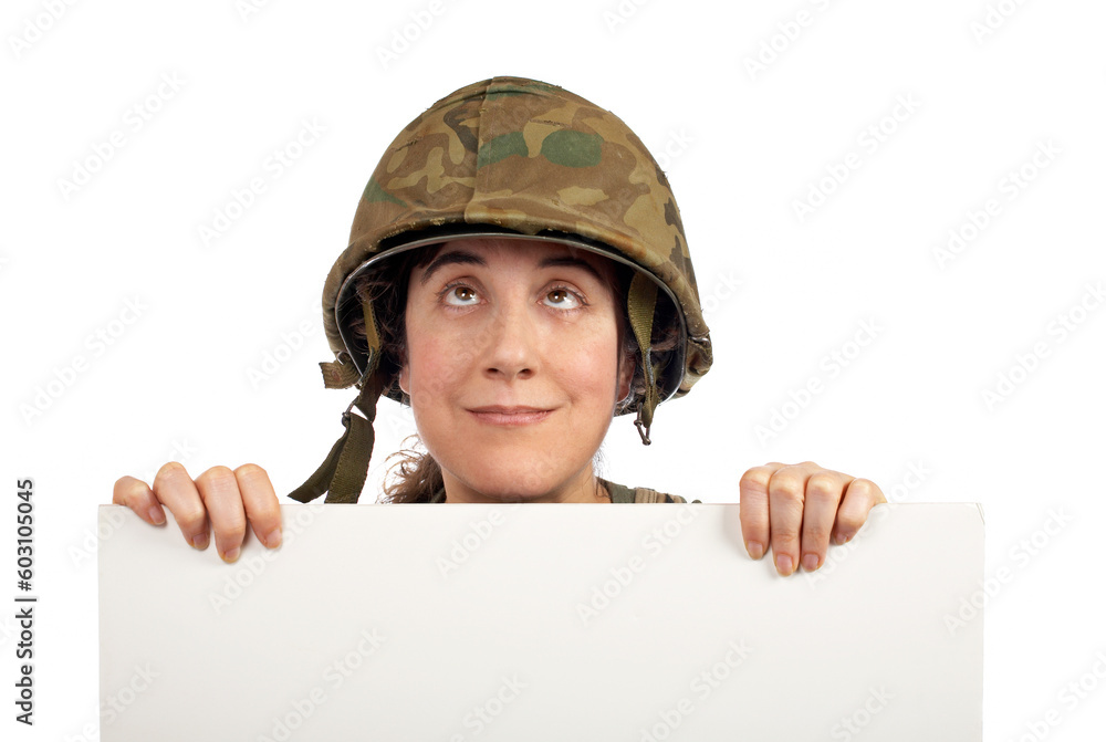 Curious soldier girl holding advertising space looking up Curious soldier girl holding advertising space looking up