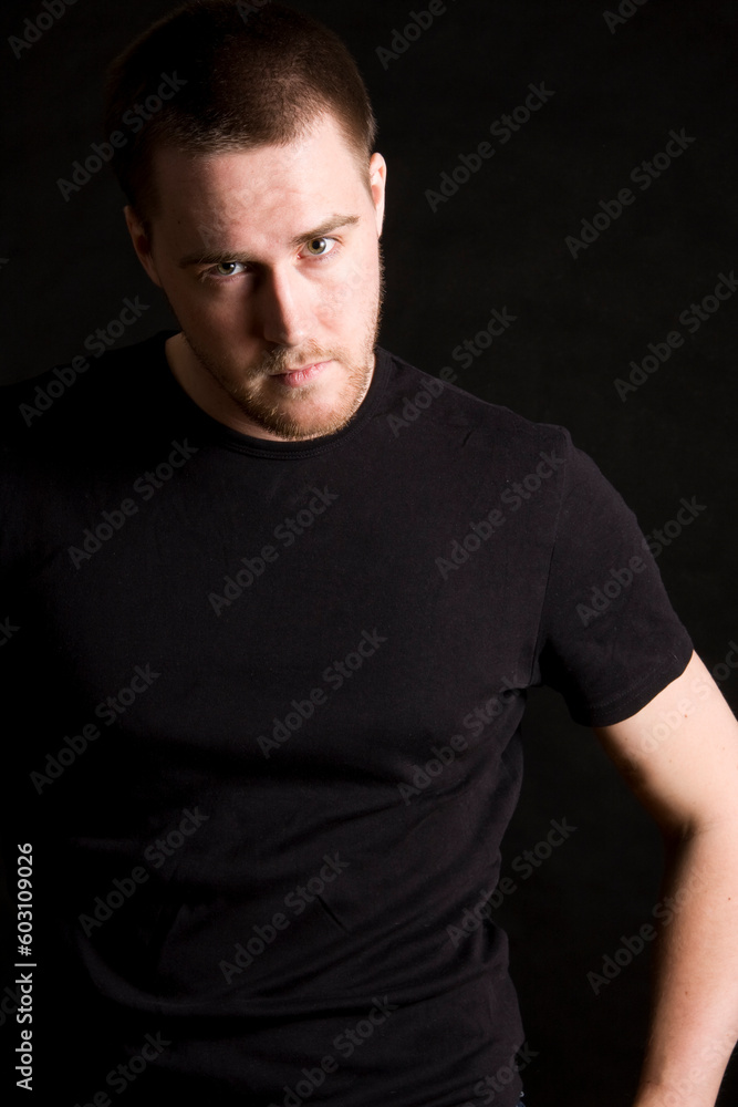 young man portrait on black background young man portrait on black background