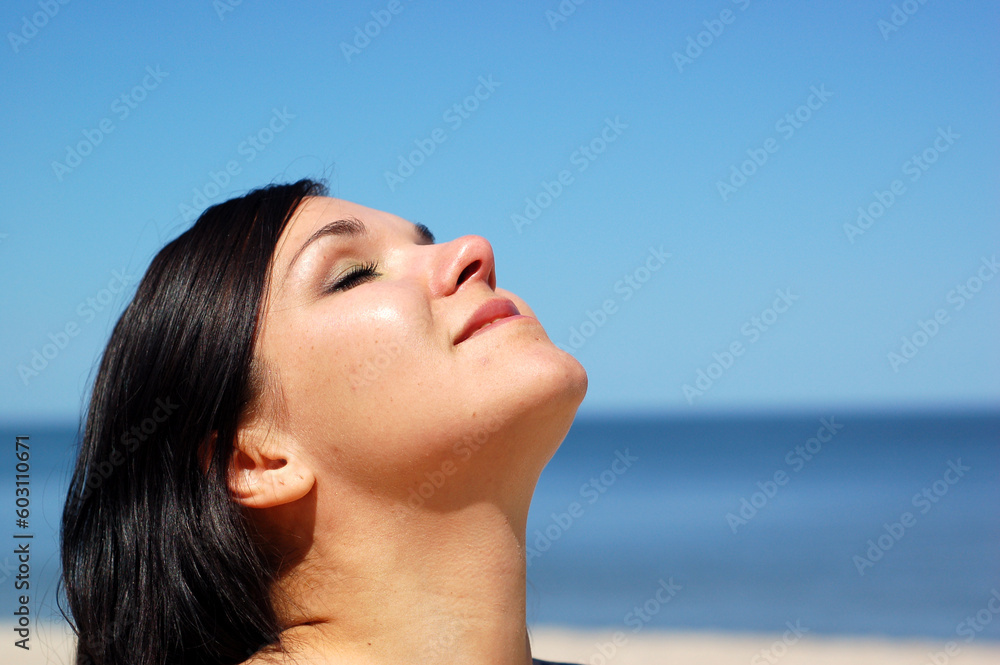 attractive woman jumping on the sunny beach attractive woman jumping on the sunny beach