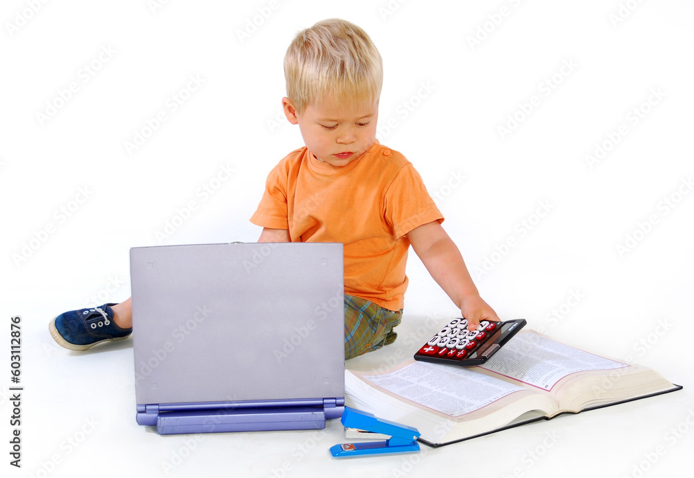 Child on floor with a calculator Child on floor with a calculator