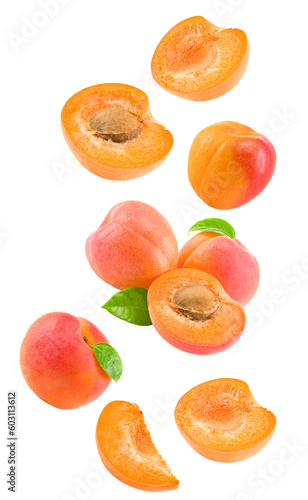 Photo flying apricot fruits with slices and green leaf isolated on white background