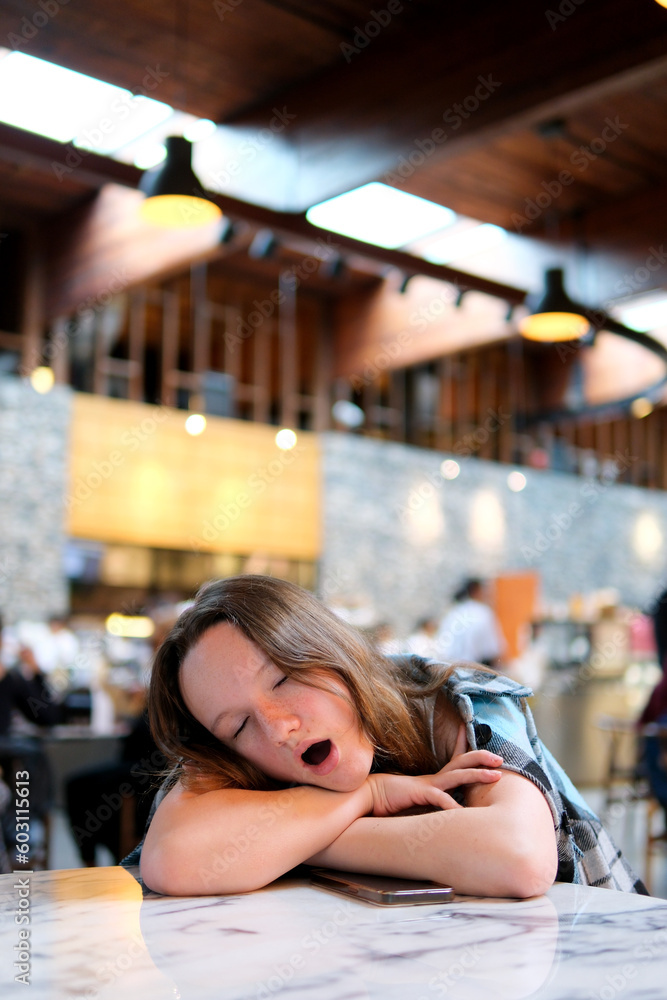 bored yawn young teenage girl falls asleep in cafe expect a friend lean on the arm close her eyes cool she throw us shoulders jacket ordinary city restaurant center rest fatigue woman bored yawn young teenage girl falls asleep in cafe expect a friend lean on the arm close her eyes cool she throw us shoulders jacket ordinary city restaurant center rest fatigue woman
