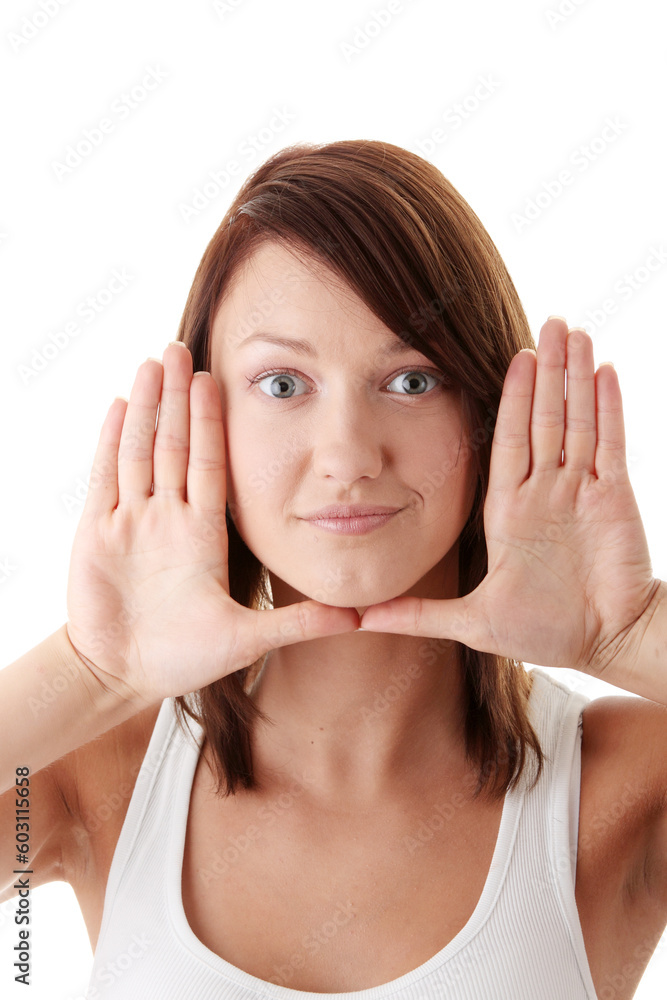 Casual caucasian young woman framing her face with her hands isolated on white background Casual caucasian young woman framing her face with her hands isolated on white background