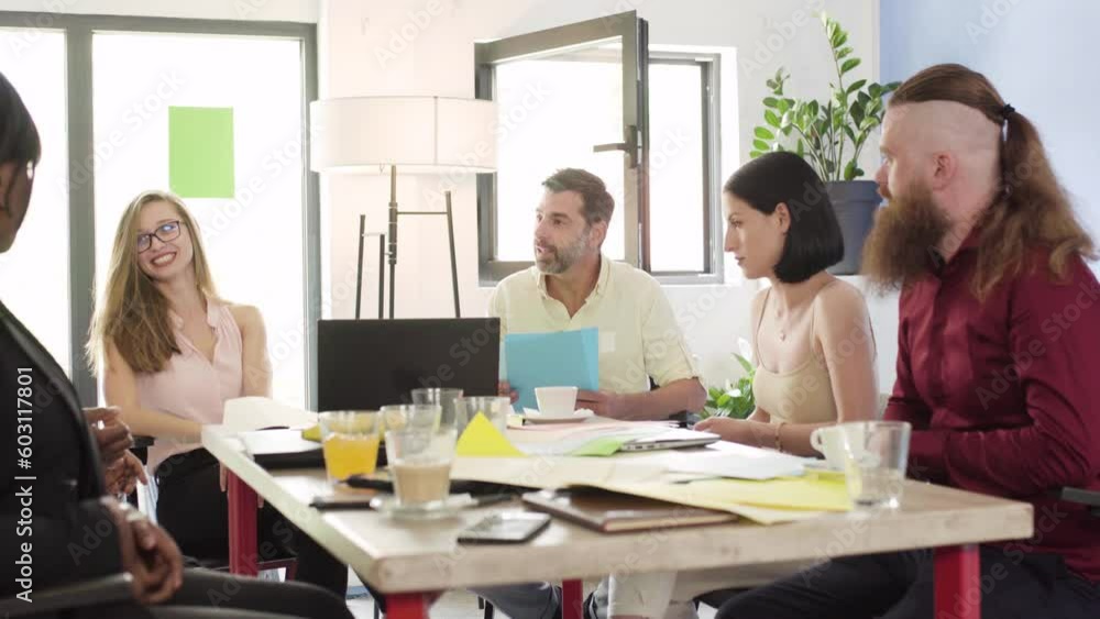 Group of people working in an office. Business meeting of multiracial startup team. Successfull colleagues brainstorming.. Group of people working in an office. Business meeting of multiracial startup team. Successfull colleagues brainstorming..