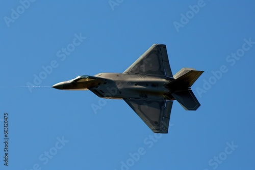 fighter jet soaring through a clear blue sky Generative AI
